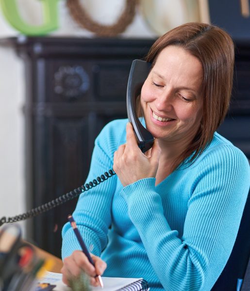 Woman on landline telephone